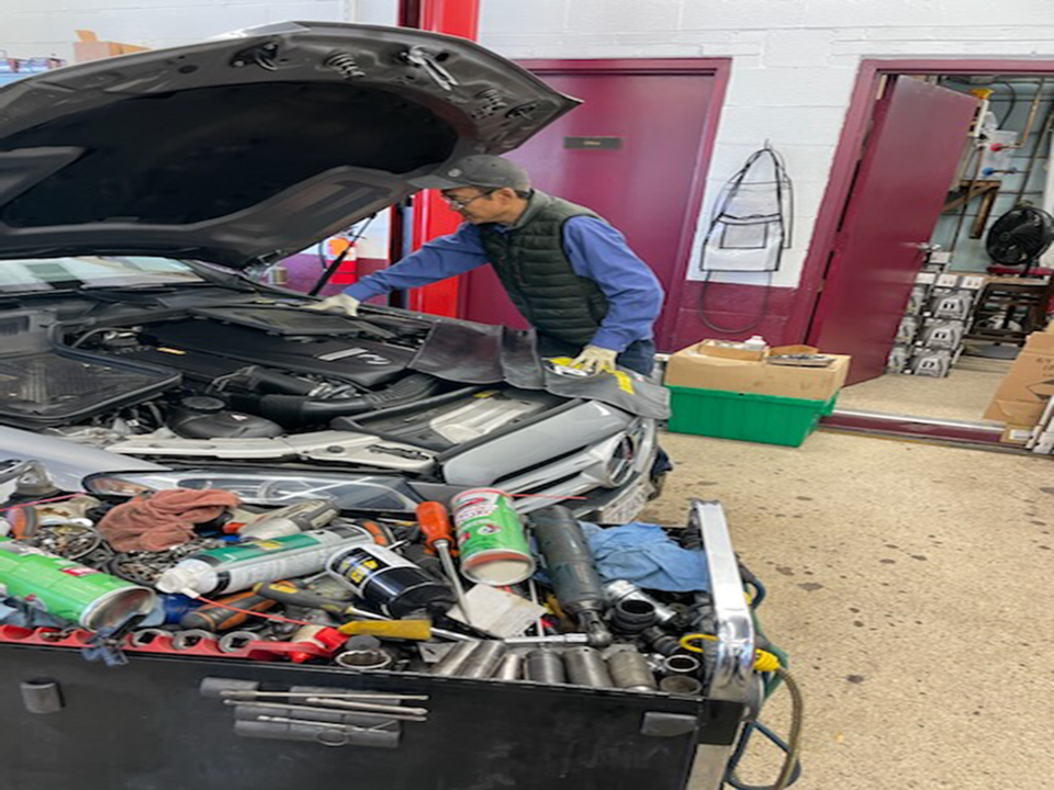 Mechanic fixing mercedes engine