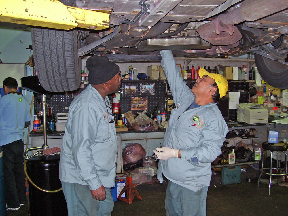 Machanics-Under-car 2 Mechanics Under a car
